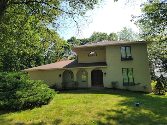 12 Enrico Rd, Bolton, CT 06043 - view of front facade with stucco siding, a front lawn, and a shingled roof