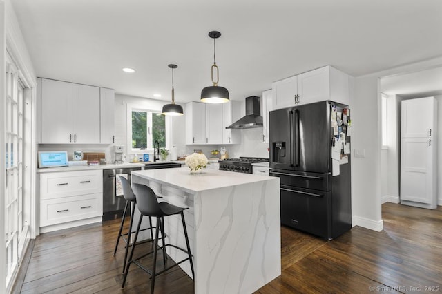1207 Stillson Rd, Fairfield, CT 06824 - kitchen with wall chimney range hood, refrigerator with ice dispenser, stainless steel dishwasher, a breakfast bar, and recessed lighting