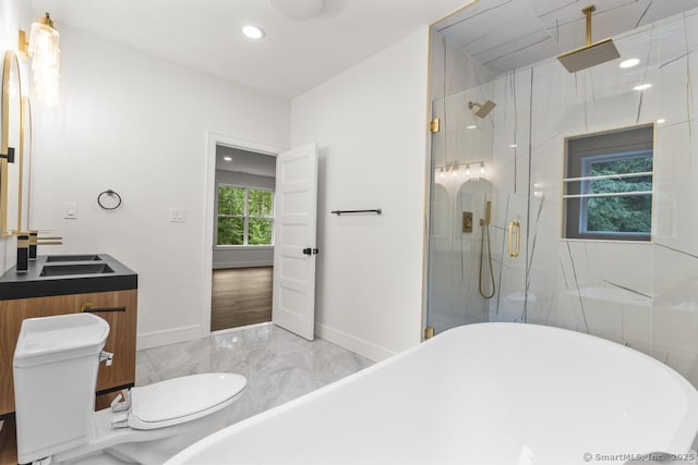 1207 Stillson Rd, Fairfield, CT 06824 - full bath featuring marble tiled floors, a freestanding tub, a marble finish shower, vanity, and recessed lighting