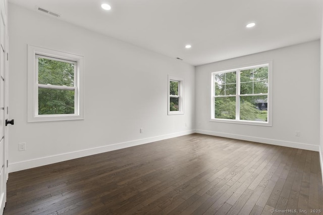 1207 Stillson Rd, Fairfield, CT 06824 - unfurnished room with dark wood-type flooring, healthy amount of natural light, and recessed lighting