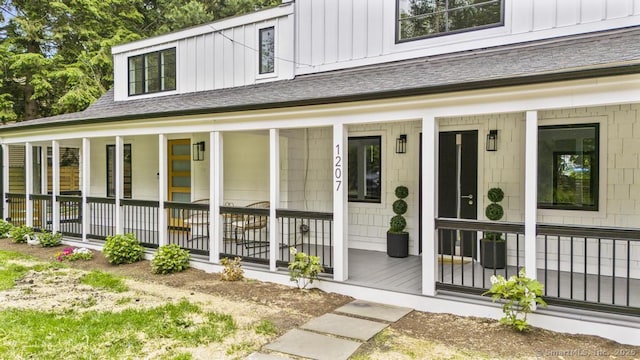 1207 Stillson Rd, Fairfield, CT 06824 - entrance to property featuring covered porch and board and batten siding