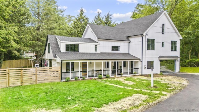 1207 Stillson Rd, Fairfield, CT 06824 - modern farmhouse featuring a porch, asphalt driveway, a shingled roof, and a carport