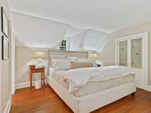 33 Great Pasture Rd, Redding, CT 06896 - bedroom featuring wood finished floors and vaulted ceiling
