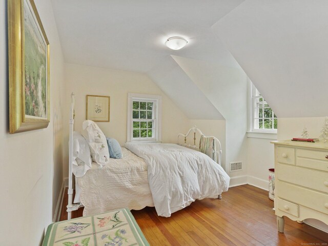 33 Great Pasture Rd, Redding, CT 06896 - bedroom with multiple windows, hardwood / wood-style flooring, and vaulted ceiling