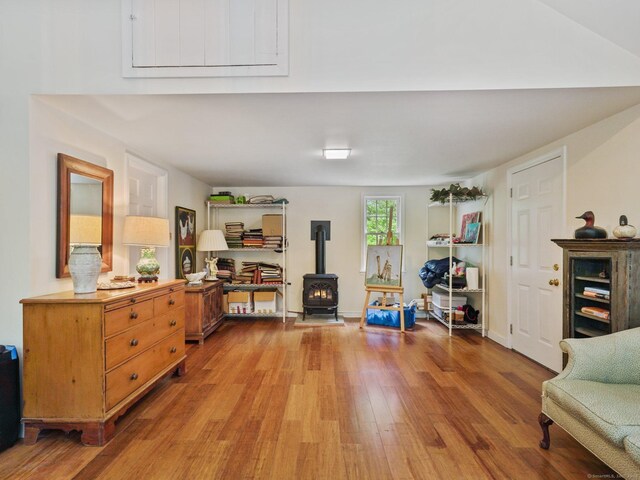 33 Great Pasture Rd, Redding, CT 06896 - living area featuring a wood stove and wood finished floors