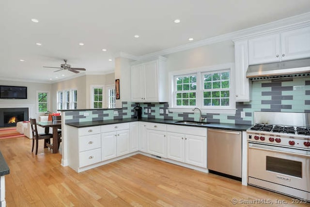 24 Nimitz Pl, Greenwich, CT 06870 - kitchen with stainless steel appliances, ornamental molding, healthy amount of natural light, open floor plan, and tasteful backsplash