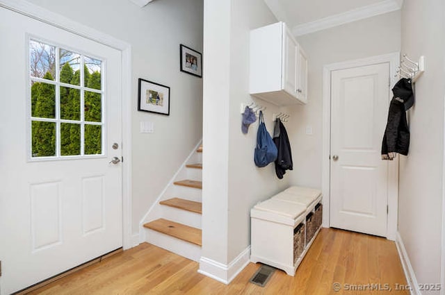 24 Nimitz Pl, Greenwich, CT 06870 - mudroom featuring light wood-style flooring and crown molding