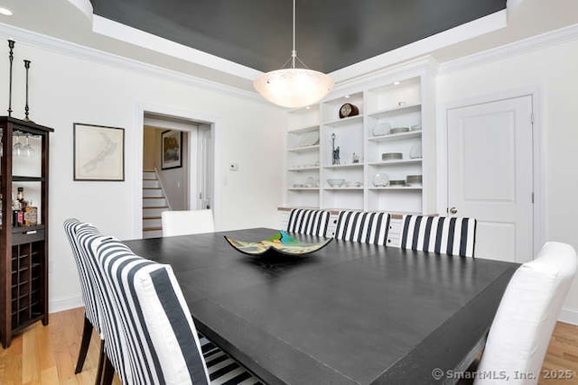 24 Nimitz Pl, Greenwich, CT 06870 - dining room with stairway, light wood-style flooring, crown molding, and a tray ceiling