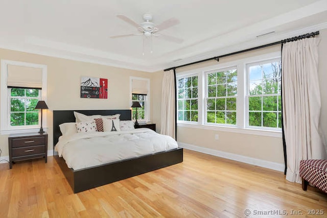 24 Nimitz Pl, Greenwich, CT 06870 - bedroom with multiple windows, light wood-style flooring, and ceiling fan