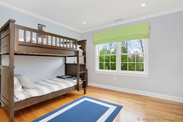 24 Nimitz Pl, Greenwich, CT 06870 - bedroom with wood finished floors, ornamental molding, and recessed lighting