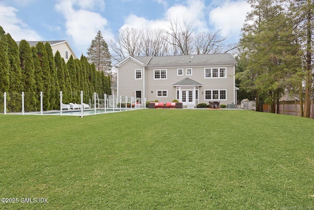24 Nimitz Pl, Greenwich, CT 06870 - view of front of house with a fenced backyard, french doors, a patio, and an outdoor living space
