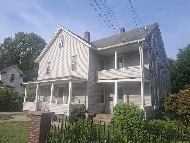 138 Harwinton Ave, Torrington, CT 06790 - view of front of house with covered porch, a chimney, and a balcony