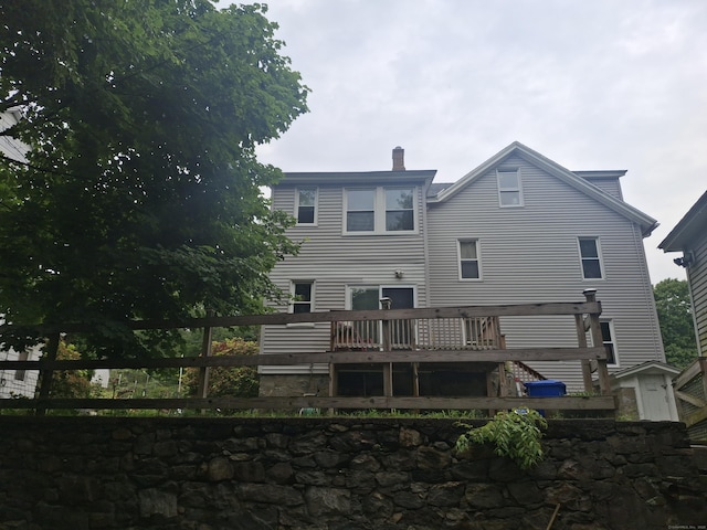 138 Harwinton Ave, Torrington, CT 06790 - back of property featuring a chimney and a wooden deck