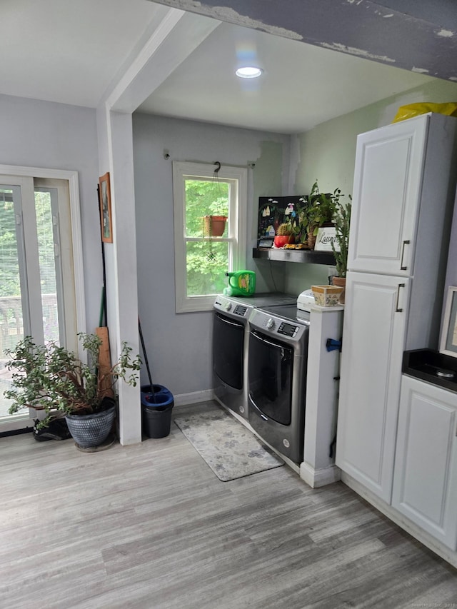 138 Harwinton Ave, Torrington, CT 06790 - laundry room with separate washer and dryer, healthy amount of natural light, light wood-style flooring, and recessed lighting
