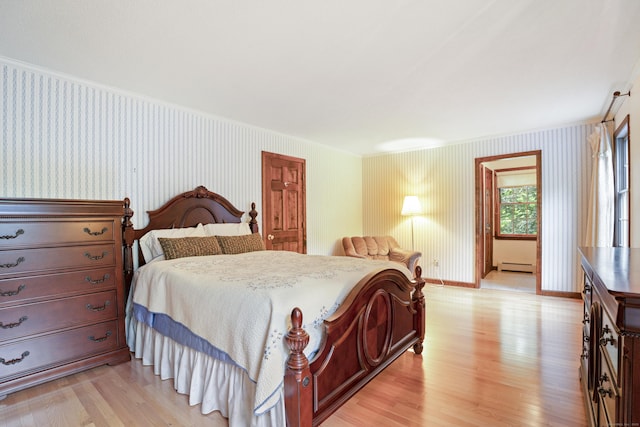 270 N Bride Brook Rd, East Lyme, CT 06333 - bedroom featuring wallpapered walls, baseboard heating, crown molding, and light wood finished floors
