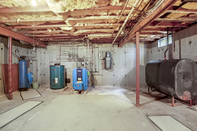 270 N Bride Brook Rd, East Lyme, CT 06333 - unfinished basement featuring oil tank, water heater, a heating unit, and a water softener system