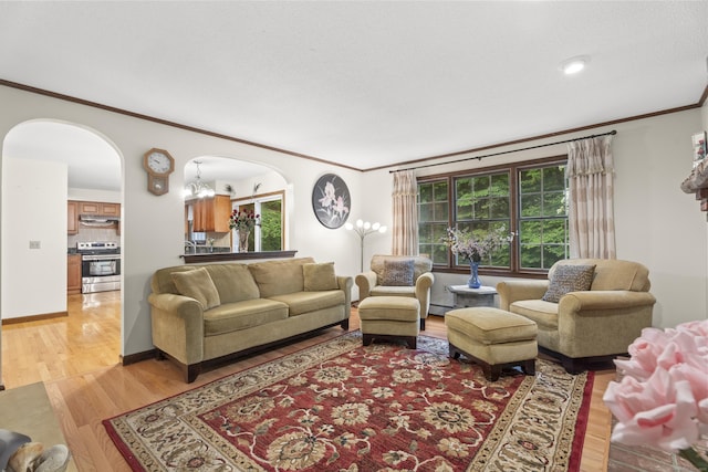 270 N Bride Brook Rd, East Lyme, CT 06333 - living area with ornamental molding, light wood-style floors, arched walkways, and baseboard heating