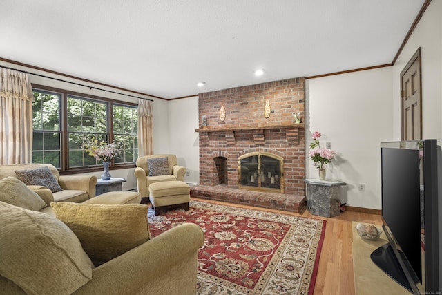 270 N Bride Brook Rd, East Lyme, CT 06333 - living area featuring ornamental molding, wood finished floors, a brick fireplace, and recessed lighting