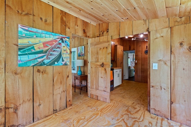 57 River Rd, Clinton, CT 06413 - hall featuring wooden walls and wood ceiling