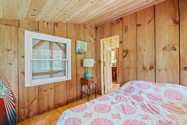 57 River Rd, Clinton, CT 06413 - bedroom with wood walls, multiple windows, and wood ceiling