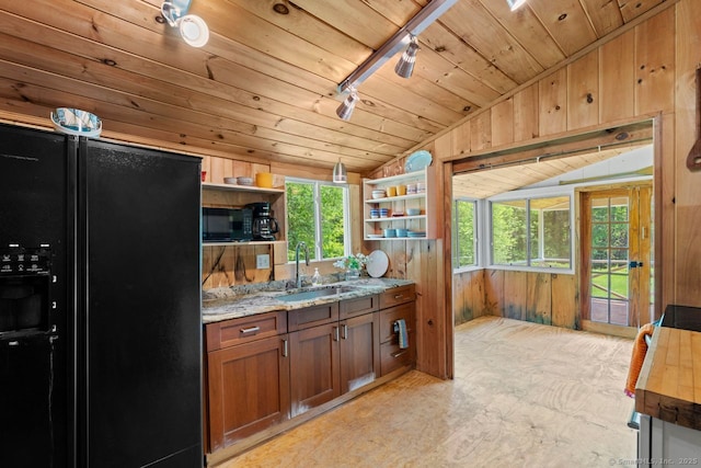 57 River Rd, Clinton, CT 06413 - kitchen with black appliances, open shelves, vaulted ceiling, wood walls, and wooden ceiling