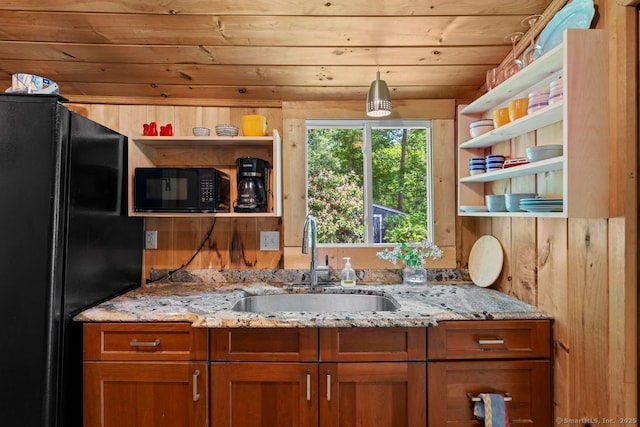 57 River Rd, Clinton, CT 06413 - kitchen featuring black appliances, open shelves, wooden ceiling, brown cabinets, and wood walls