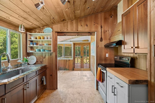 57 River Rd, Clinton, CT 06413 - kitchen featuring electric stove, vaulted ceiling, wood walls, wood ceiling, and open shelves