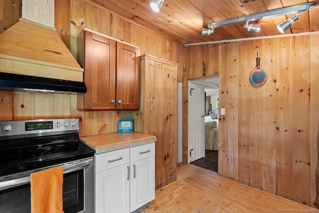 57 River Rd, Clinton, CT 06413 - kitchen featuring stainless steel electric stove, wood ceiling, custom range hood, light countertops, and light wood-type flooring