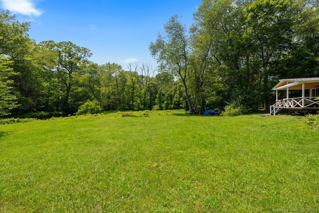 57 River Rd, Clinton, CT 06413 - view of green lawn with a forest view