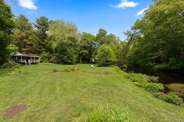 57 River Rd, Clinton, CT 06413 - view of grassy yard featuring a view of trees