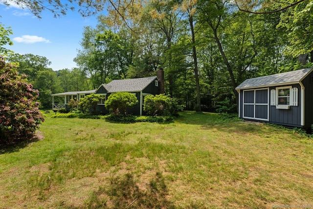 57 River Rd, Clinton, CT 06413 - view of grassy yard with a storage unit
