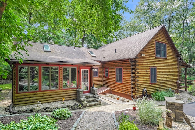80 Jill Ln, Cheshire, CT 06410 - view of front of home with log siding, entry steps, a shingled roof, and a sunroom