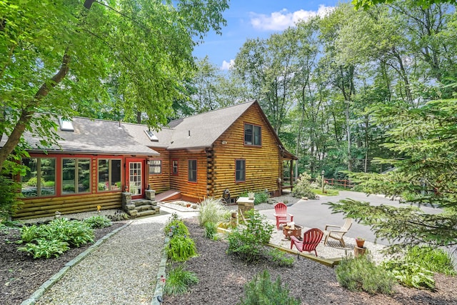 80 Jill Ln, Cheshire, CT 06410 - back of house featuring a patio, log exterior, entry steps, and roof with shingles