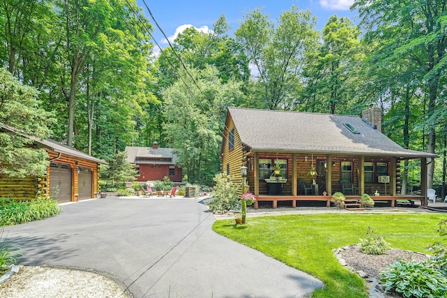 80 Jill Ln, Cheshire, CT 06410 - log cabin featuring a porch, a front lawn, a chimney, an outbuilding, and a garage