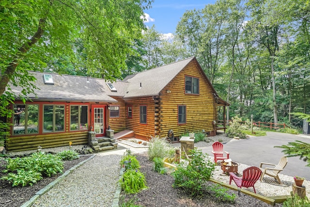 80 Jill Ln, Cheshire, CT 06410 - back of house featuring a fire pit, a patio area, log exterior, a shingled roof, and entry steps