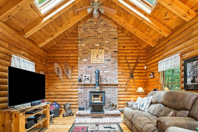 80 Jill Ln, Cheshire, CT 06410 - living room with a skylight, high vaulted ceiling, a wood stove, hardwood / wood-style floors, and a ceiling fan