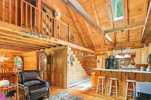 80 Jill Ln, Cheshire, CT 06410 - living room featuring a baseboard heating unit, a wooden ceiling with exposed beams, a chandelier, light wood-style floors, and healthy amount of natural light