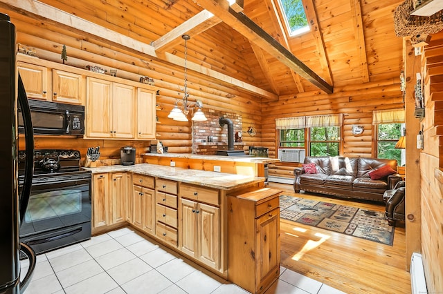 80 Jill Ln, Cheshire, CT 06410 - kitchen featuring black appliances, a peninsula, a wood stove, rustic walls, and a skylight