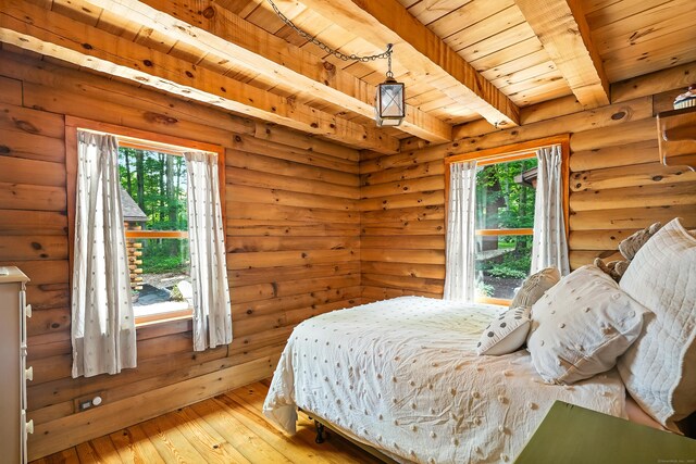 80 Jill Ln, Cheshire, CT 06410 - bedroom with a wood ceiling with exposed beams, light wood-type flooring, and log walls
