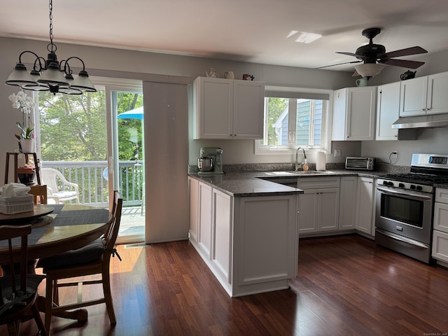 2480 Whitney Ave Unit 2, Hamden, CT 06518 - kitchen with stainless steel gas range oven, under cabinet range hood, a chandelier, and dark wood-style flooring