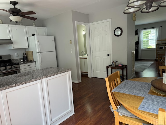 2480 Whitney Ave Unit 2, Hamden, CT 06518 - kitchen with freestanding refrigerator, stainless steel range with gas cooktop, under cabinet range hood, ceiling fan, and white cabinetry