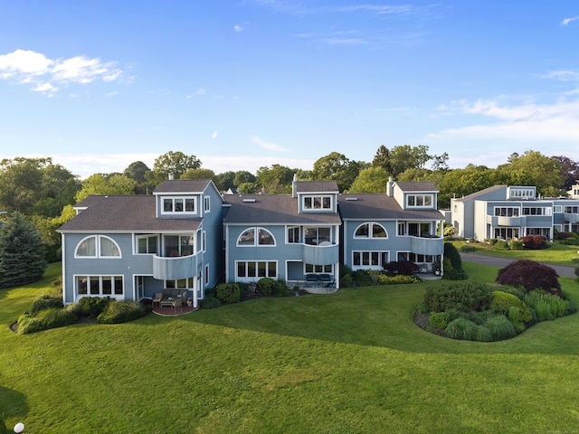 8 Oyster Landing Rd Unit 8, Milford, CT 06460 - back of house with a lawn and a balcony