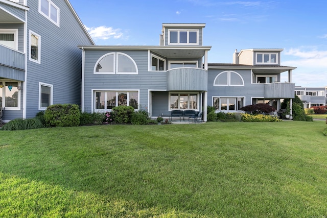 8 Oyster Landing Rd Unit 8, Milford, CT 06460 - back of house with a balcony, a lawn, and a patio area