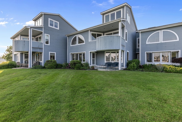 8 Oyster Landing Rd Unit 8, Milford, CT 06460 - back of house with a balcony, a yard, and a patio