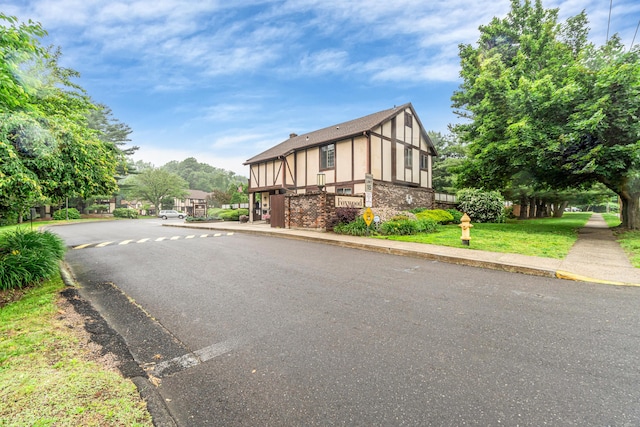 304 Foxwood Ln Unit 304, Milford, CT 06461 - view of asphalt road featuring curbs and sidewalks