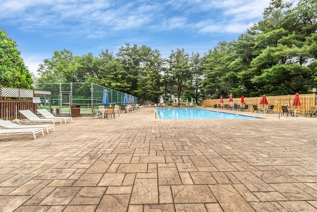 304 Foxwood Ln Unit 304, Milford, CT 06461 - community pool featuring a patio area and view of scattered trees