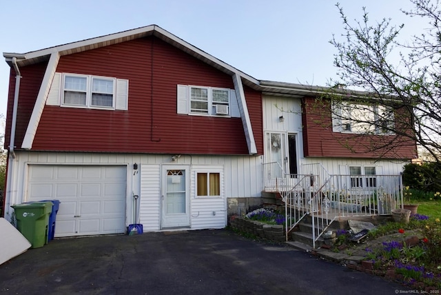 11 Kenneth Cir, Windsor, CT 06095 - view of front of property with a garage, driveway, and board and batten siding