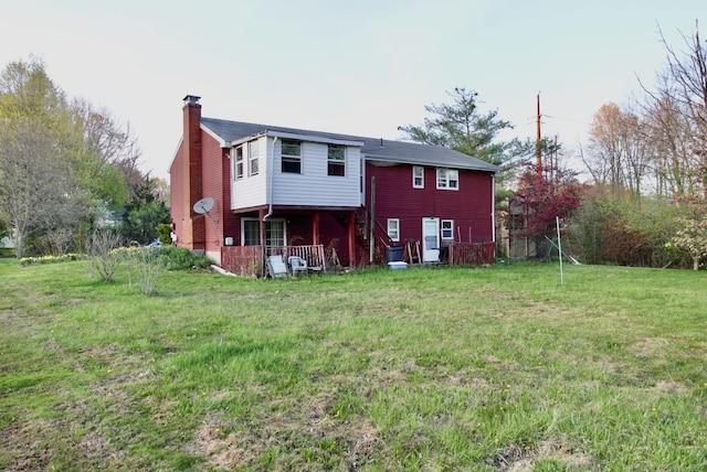 11 Kenneth Cir, Windsor, CT 06095 - rear view of property with a chimney and a lawn