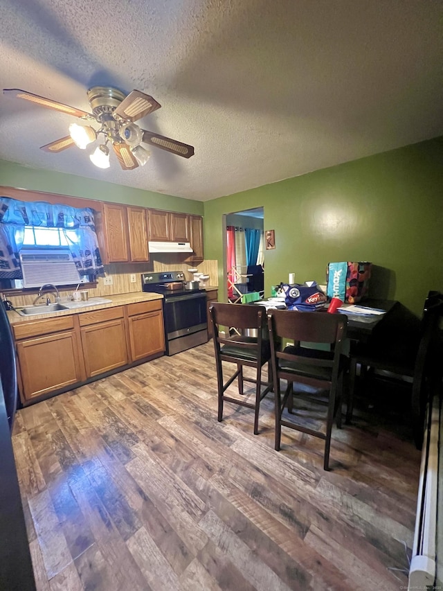 11 Kenneth Cir, Windsor, CT 06095 - kitchen with stainless steel electric range oven, under cabinet range hood, light wood-style flooring, a textured ceiling, and a ceiling fan