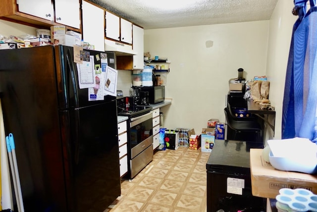 11 Kenneth Cir, Windsor, CT 06095 - kitchen with freestanding refrigerator, stainless steel electric range oven, under cabinet range hood, white cabinetry, and a textured ceiling